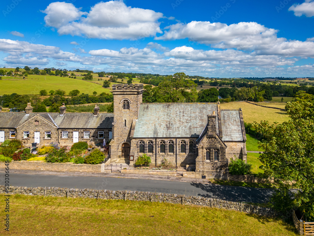 Aerial view of church on a sunny day in North Yorkshire countryside