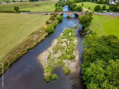 Aerial view over River Wharfe and Pool Bridge, West Yorkshire photo