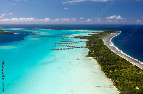 Aerial Bora Bora Overwater luxury bungalows tropical Island © Spotmatik