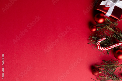 Image of christmas decoration and copy space on red background