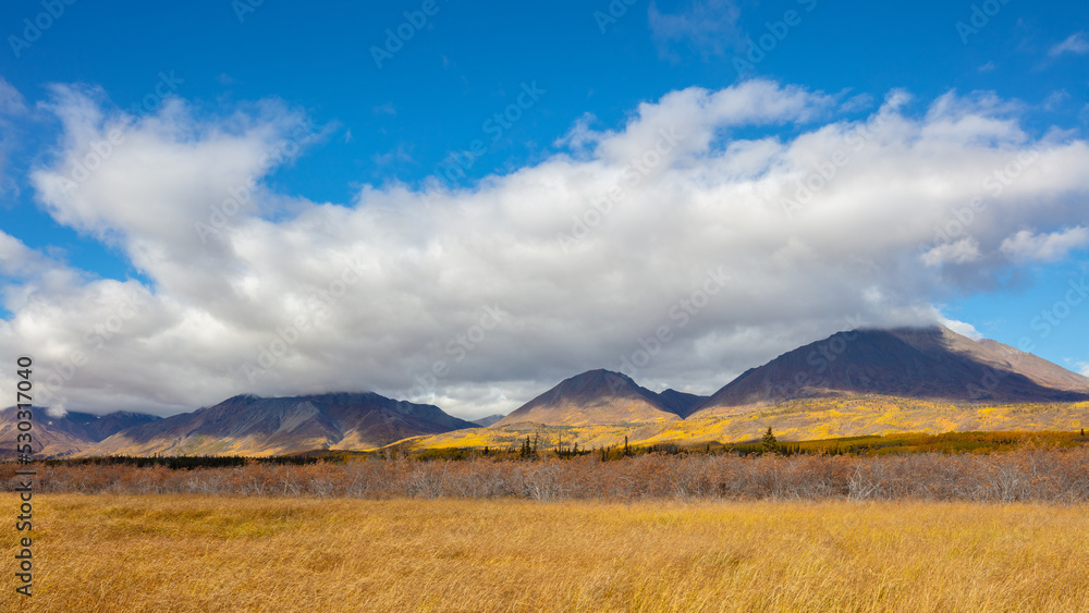 Autumn in northern Canada: clouds over a mountain landscape in Yukon Territory. 