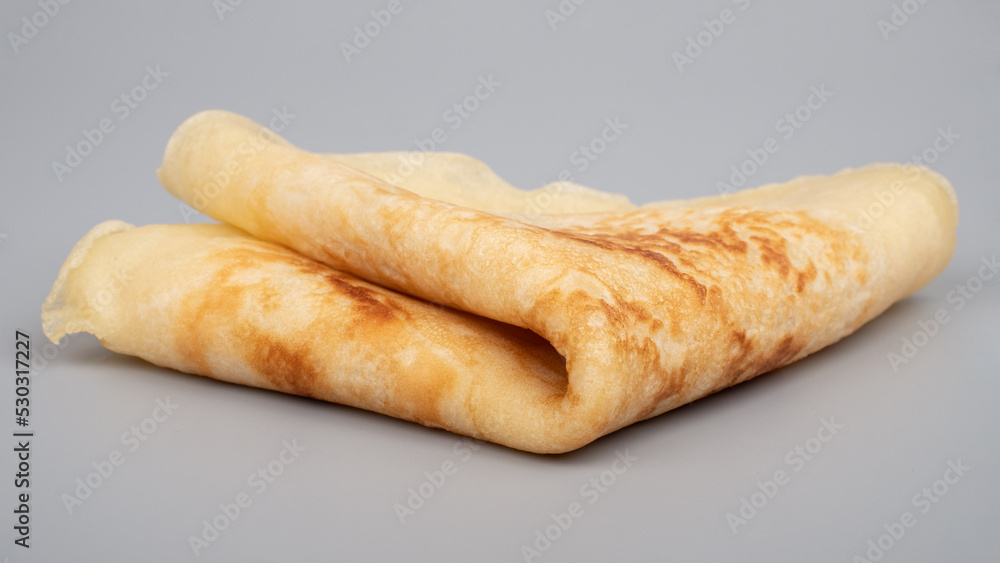 fried pancake closeup on a gray backgroun fried pancake closeup on a gray backgroun