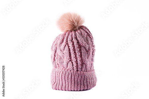 Image of wool beanie with pom pom on white surface