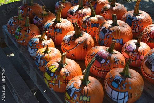 Obraz na plátně Halloween colorful decorated pumpkins with faces collection at farm shop