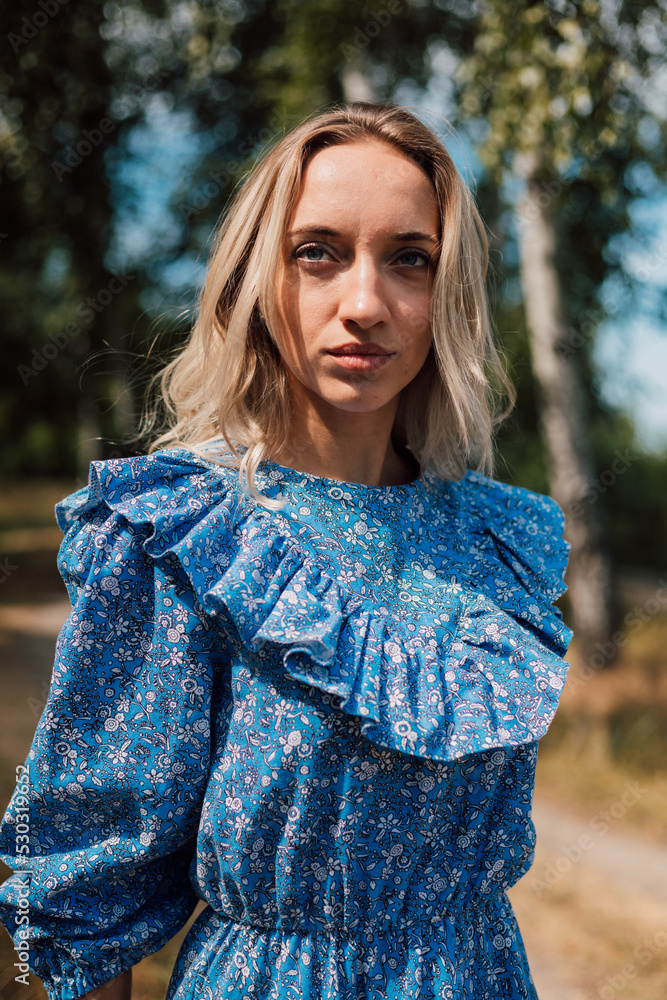 Portrait of a young beautiful blonde woman in the forest in nature Portrait of a young beautiful blonde woman in the forest in nature