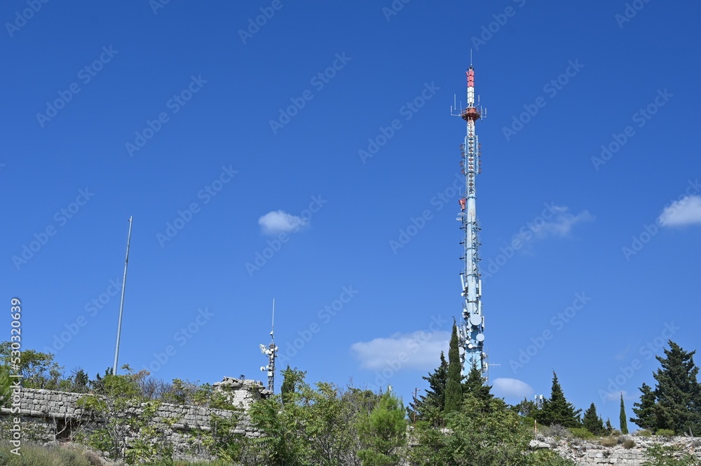 Obraz premium A mobile phone mask on a hill in Dubrovnik.