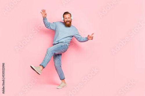 Full length photo of overjoyed person enjoy new playlist dancing isolated on pink color background