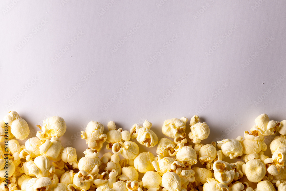 Image of pop corn lying on white background Image of pop corn lying on white background