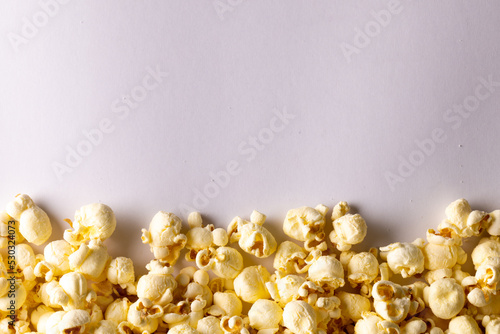 Image of pop corn lying on white background © vectorfusionart