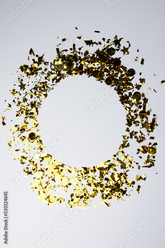 Composition of close up of new years confetti on white background