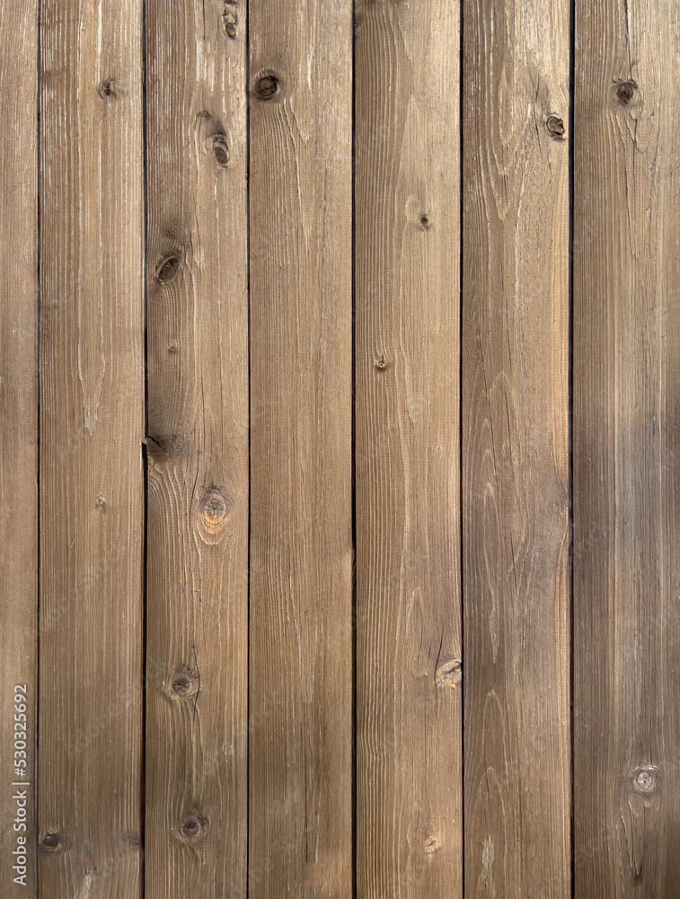 Fototapeta premium Vertical wooden planks with knots. Wooden background.