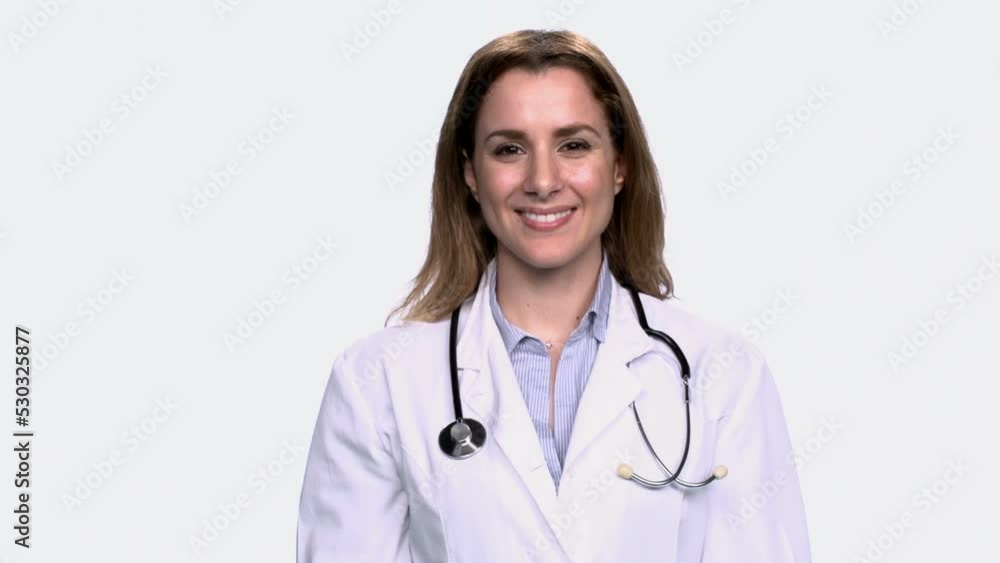 Female doctor on white background smiling Female doctor on white background smiling