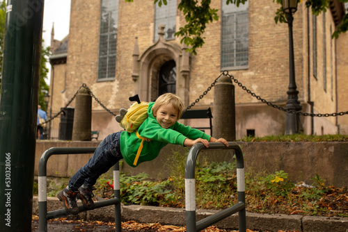 Photography Toddler child in the center of Oslo, capital of Norway, eating ice cream
