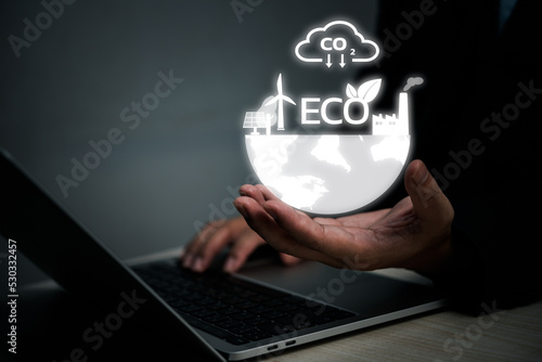 Businessman touching screen virtual icon eco energy sustainable environment digital technology concept.