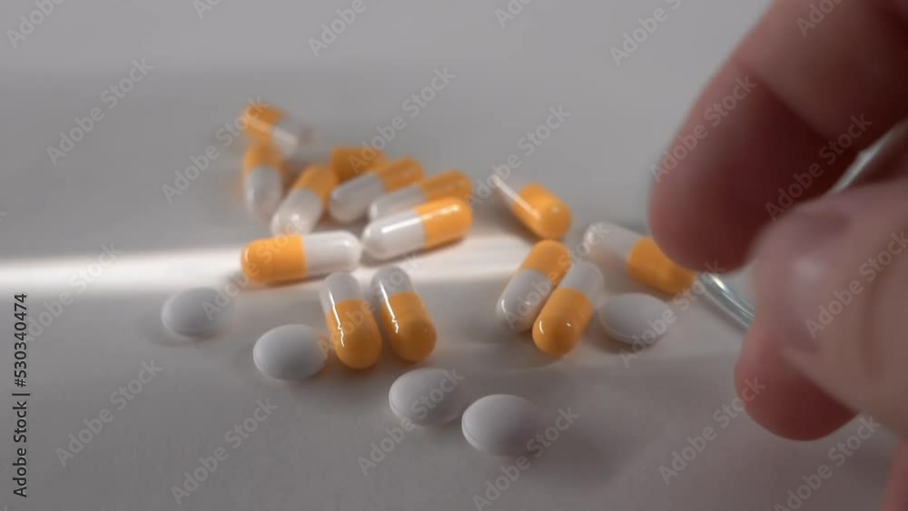 a set of pills. take a pill. light background