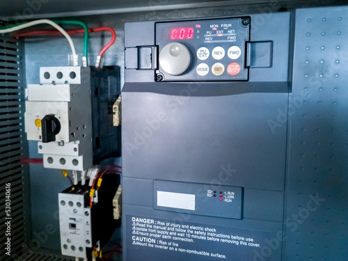 Frequency inverter, and circuit breaker in electrical cabinet of automation control system.