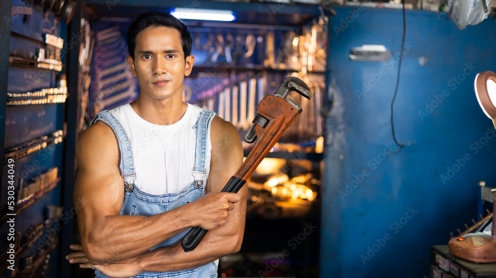 Obraz premium Portrait young asian male mechanic engineering working on Vehicle in a Car Service. Repair service specialist, technical maintenance