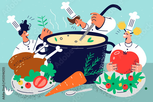 Group of chefs cooking together 