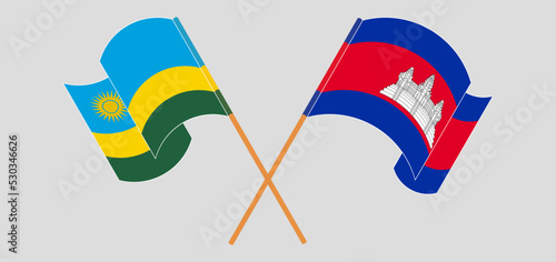 Crossed and waving flags of Rwanda and Cambodia photo