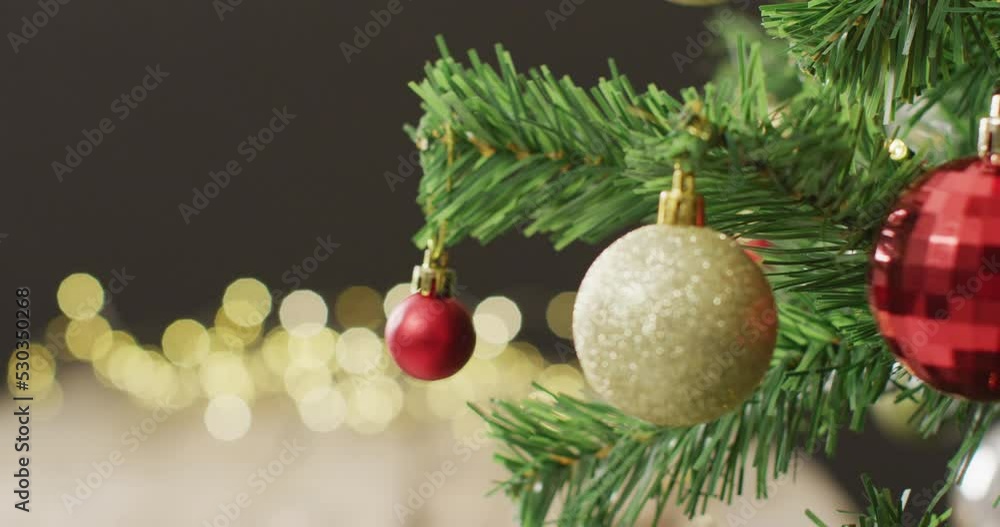 Video of christmas tree with baubles and fairy lights on black background Video of christmas tree with baubles and fairy lights on black background