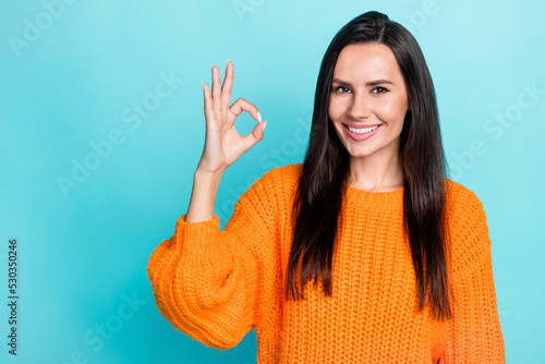 Photo of positive nice lady toothy smile show okey symbol rate nice isolated on teal color background