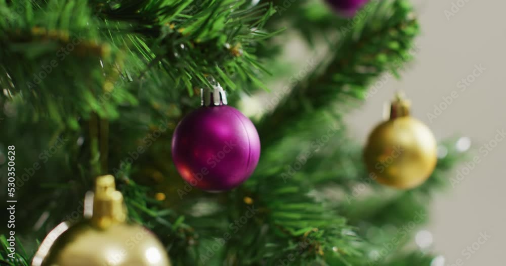 Closeup of christmas balls and decorations on the green christmas tree Closeup of christmas balls and decorations on the green christmas tree