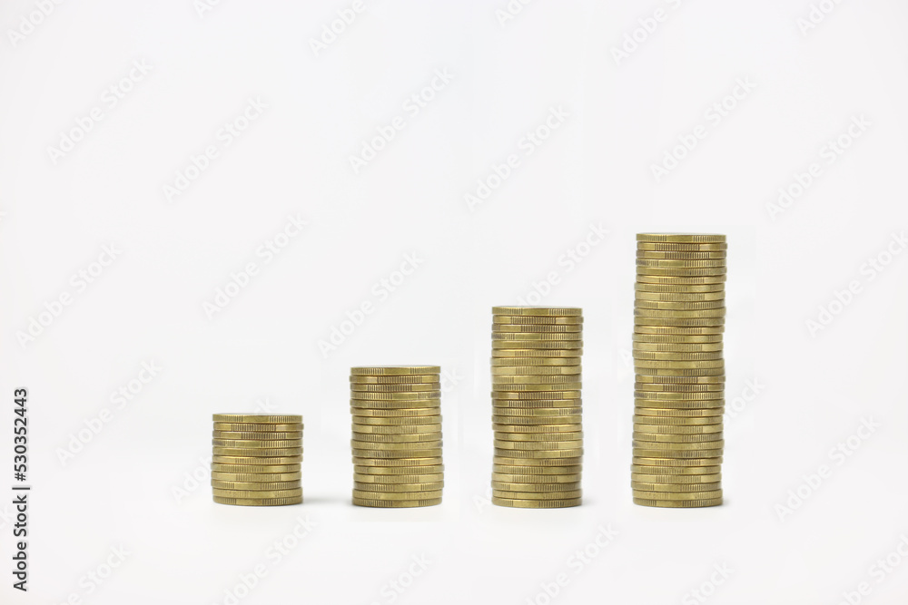 Stacked coins on a white isolated background. Investment growth concept Stacked coins on a white isolated background. Investment growth concept