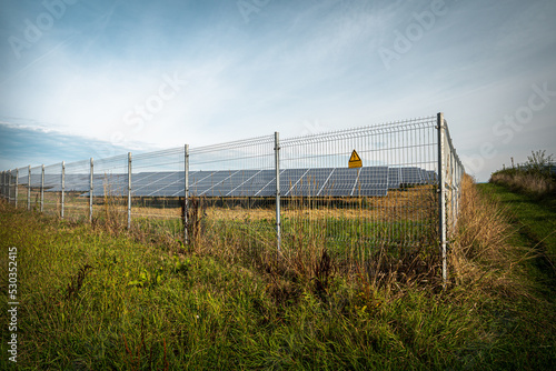 Renewable energy from solar panels in a solar park to generate clean energy.