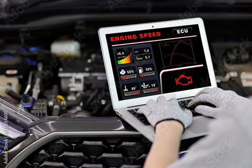 Canvastavla Auto mechanic working with car diagnostic tool in a repair shop.