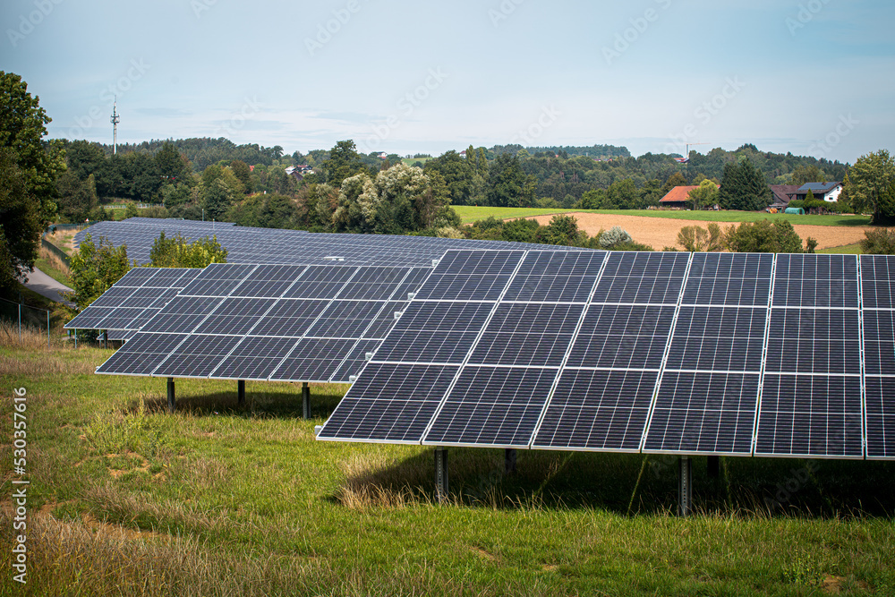 Solar panels in solar power plant in Germany Bavaria. Renewable energy through solar panels to generate clean energy. Green electricity. Solar panels in solar power plant in Germany Bavaria. Renewable energy through solar panels to generate clean energy. Green electricity.