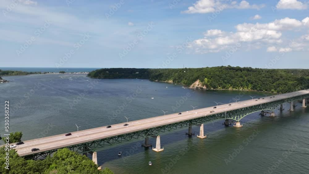 Timelapse of motor boats and other watercraft traveling under bay bridge in Irondequoit, New York beside Lake Ontario Timelapse of motor boats and other watercraft traveling under bay bridge in Irondequoit, New York beside Lake Ontario