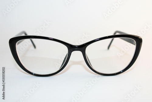 Black thick framed glasses in a retro style