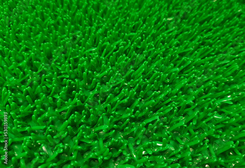 A close-up of artificial grass with selective focus