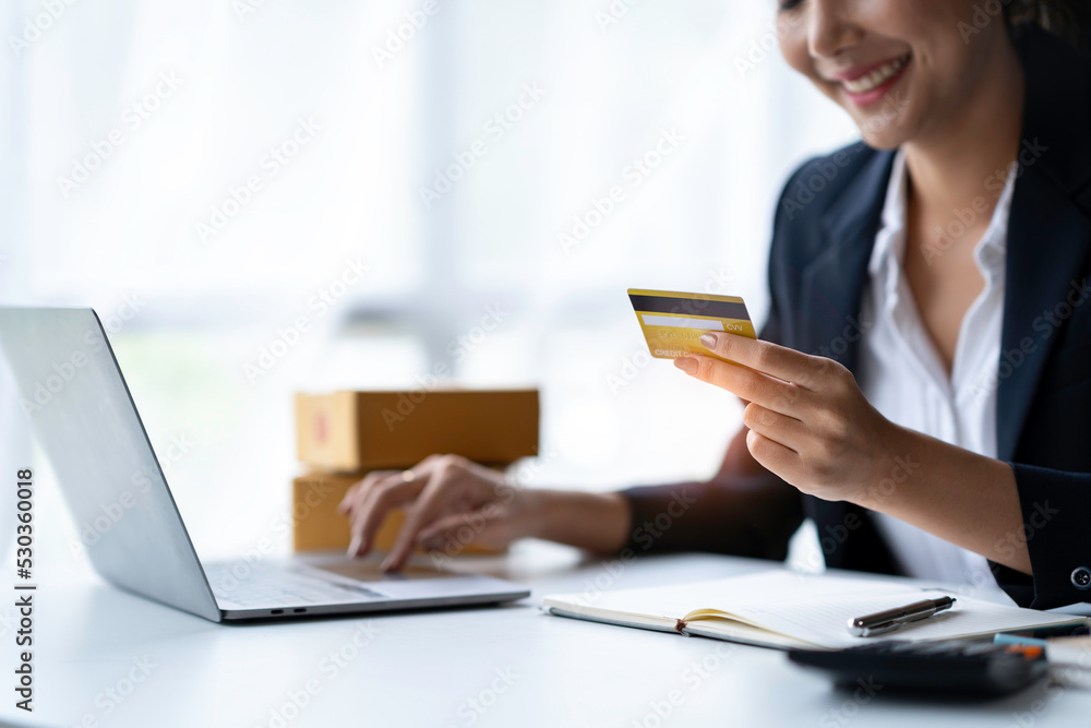 Asian businesswoman hands holding smartphone shopping online with a credit card. Online Payment. Online shopping Asian businesswoman hands holding smartphone shopping online with a credit card. Online Payment. Online shopping