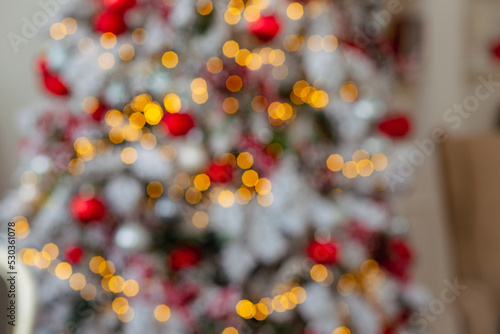 Blurred gold and red bokeh texture. Multicolored circles.