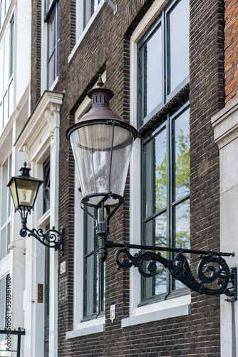 Details and facades of Amsterdam characteristic brick construction of residential building in Amsterdam School style. High quality photo
