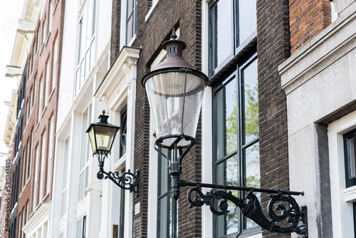 Details and facades of Amsterdam characteristic brick construction of residential building in Amsterdam School style. High quality photo
