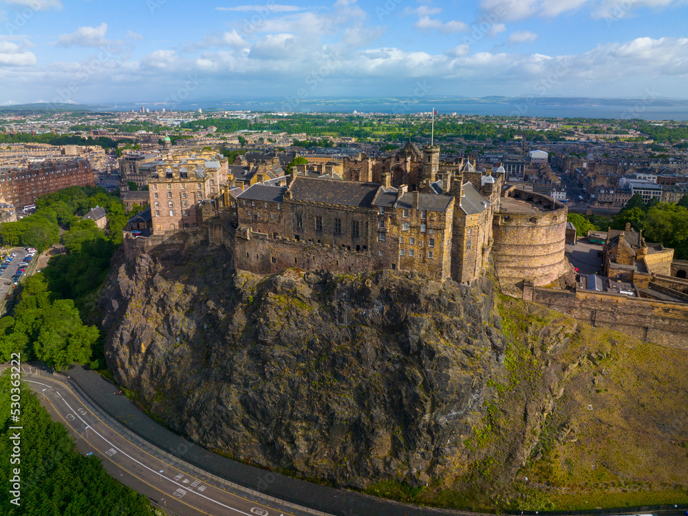 Obraz premium Edinburgh Castle is a historic castle stands on Castle Rock in Old Town Edinburgh, Scotland, UK. Old town Edinburgh is a UNESCO World Heritage Site since 1995. 