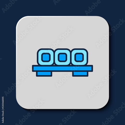 Filled outline Sushi on cutting board icon isolated on blue background. Asian food sushi on wooden board. Vector