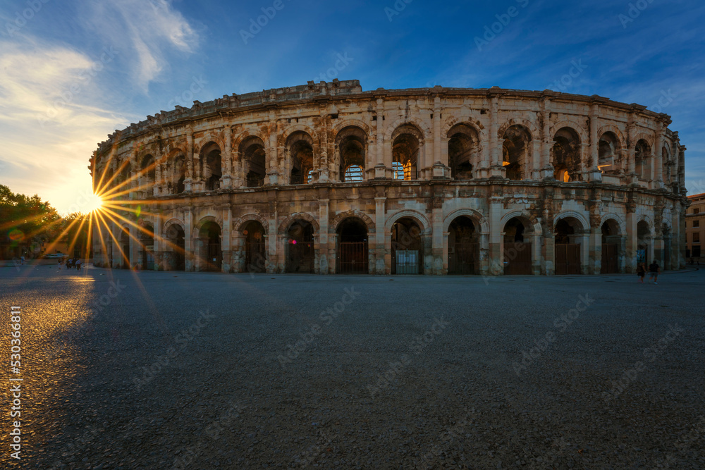 View of famous arena at sunset, Nimes