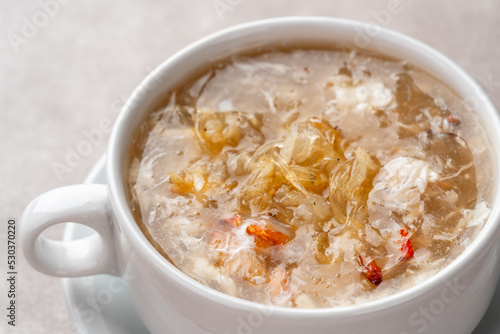 Shark fin soup (Indonesia : Soup Sirip Ikan Hiu) is a popular soup in Chinese cuisine which is usually served on special occasions such as weddings or banquets. photo