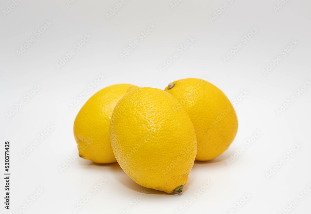Lemons on a white background close-up. Lemons on a white background close-up.