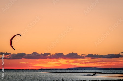 Kitesurfing sunset beach