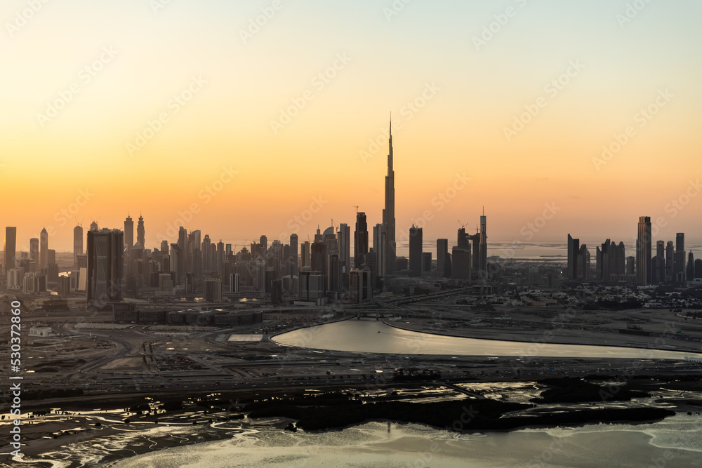 Aerial sunset view Dubai building land development UAE