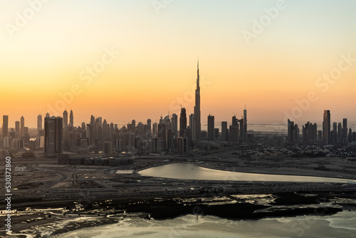 Aerial sunset view Dubai building land development UAE