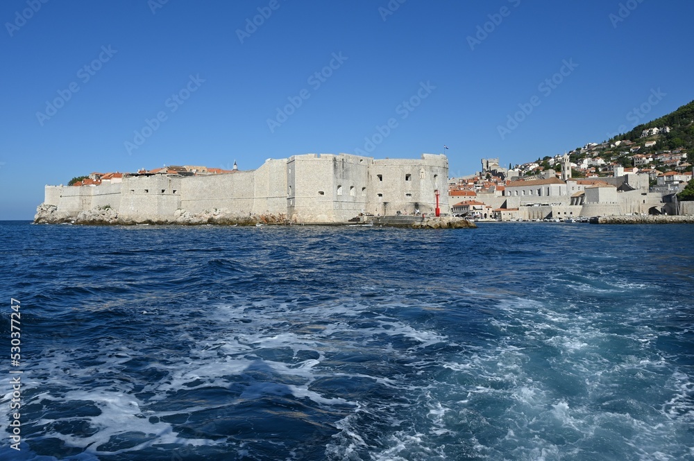 The outer walls of the old walled town of Dubrovnik at Dalmatia in Croatia from the sea. 