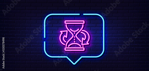 Neon light speech bubble. Time hourglass refresh line icon. Sand watch sign. Neon light background. Hourglass glow line. Brick wall banner. Vector