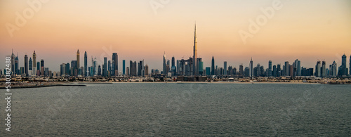 Aerial Panorama sunset view of Dubai city skyscrapers