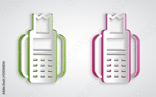 Paper cut POS terminal with inserted credit card and printed reciept icon isolated on grey background. NFC payment concept. Paper art style. Vector