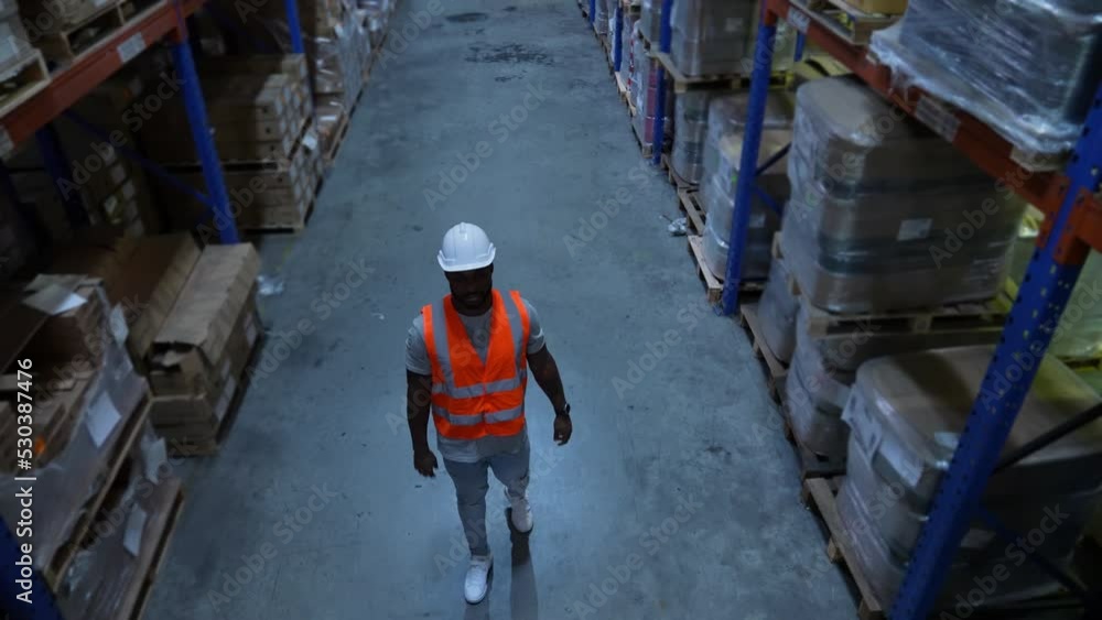Business concept of 4k Resolution. The supervisor is walking to inspect the work in the warehouse. Business concept of 4k Resolution. The supervisor is walking to inspect the work in the warehouse.